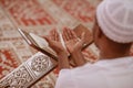 Top viewv of African Muslim Man Making Traditional Prayer To God While Wearing A Traditional Cap Dishdasha Royalty Free Stock Photo