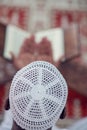 Top viewv of African Muslim Man Making Traditional Prayer To God While Wearing A Traditional Cap Dishdasha Royalty Free Stock Photo