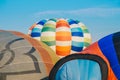 The top of an vivid envelope of hot air balloons before floating.