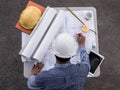 Top viwe, Engineers in helmets planning new project on table. Architect working on blueprint Royalty Free Stock Photo