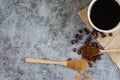 Top viwe  ground coffee in wooden spoon and fresh roasted coffee beans. Royalty Free Stock Photo