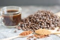 Top viwe  ground coffee in wooden spoon and fresh roasted coffee beans. Royalty Free Stock Photo