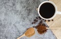 Top viwe ground coffee in a wooden spoon and freshly roasted coffee beans. Royalty Free Stock Photo