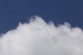 Top of white fluffy cloud against blue sky Royalty Free Stock Photo