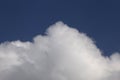 top of white fluffy cloud against clear blue sky Royalty Free Stock Photo
