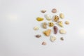 Top wide shot of several colorful stones that collected from beach on white background Royalty Free Stock Photo