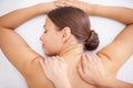 Top of woman, back massage and hands of masseuse in spa, aromatherapy and healing with wellness. Calm, natural with Royalty Free Stock Photo