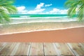 Top of wood table with blurred sea and coconut tree background - Royalty Free Stock Photo