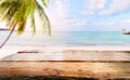 Top of wood table on blurred sea with coconut tree background Royalty Free Stock Photo