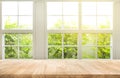 Top of wood table counter on blur window view garden background. Royalty Free Stock Photo