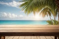 Top of wood table with seascape and palm leaves, blur bokeh light of calm sea and sky at tropical beach background. Empty ready fo Royalty Free Stock Photo