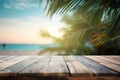 Top of wood table with seascape and palm leaves, tropical beach background Royalty Free Stock Photo