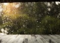 Top of wooden plank with  rain drops falling from roof. Royalty Free Stock Photo