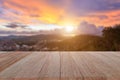 Top wooden table and blur sunset background