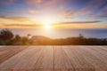 Top wooden table and blur sunset background