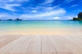 Top wooden table and blur of tropical beach background Royalty Free Stock Photo
