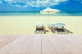 Top wooden table and blur of tropical beach background Royalty Free Stock Photo