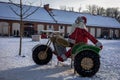 LED Christmas illumination of Santa Claus riding a vintage motorcycle with a sidecar. Royalty Free Stock Photo