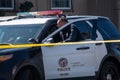 A Topanga Division LAPD patrol unit blocks a road at a crime scene in Reseda, CA