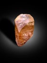 Topaz sherry color crystal with etched textured on surface isolated on black shaded background crystal from skardu pakistan
