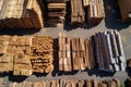 topdown view of organized wood stacks at an outdoor lumberyard