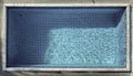 Topdown view of a small, rectangular swimming pool