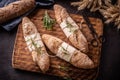 Tope view of freshly baked pastry bread on a vintage wooden board with dark background