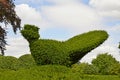 Decorative Topiary Bird on a tree in a country garden