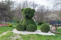 Topiary figures made of grass on the streets of the city.