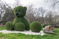 Topiary figures made of grass on the streets of the city.