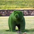 Topiary sculpture of a bear made of artificial grass