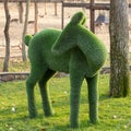 Topiary sculpture of a deer made of artificial grass