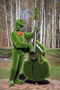 Topiary sculpture of a musician in the park