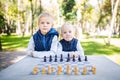 The topic children learning, logical development, mind and math, miscalculation moves advance. large family brothers and sister Royalty Free Stock Photo