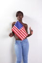 Topless black woman with American national flag Royalty Free Stock Photo