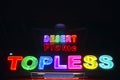 Topless neon sign advertising a strip club near Phoenix AZ