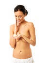 Topless woman with cream container Royalty Free Stock Photo