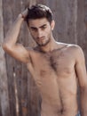 Handsome topless young man outdoors