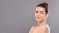 Topless young lady over gray studio background Royalty Free Stock Photo