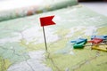 Topographic map with colored flag pushpins close up Royalty Free Stock Photo