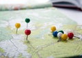 Topographic map with colored needles pushpins close up Royalty Free Stock Photo