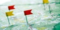 Topographic map with colored flag pushpins close up Royalty Free Stock Photo