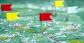 Topographic map with colored flag pushpins close up Royalty Free Stock Photo