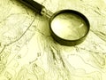 Topographic map with magnifier Royalty Free Stock Photo