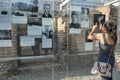 Topography of Terror, Berlin, Germany - July 2015 - young female tourist taking photos Royalty Free Stock Photo