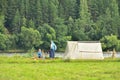 Toporok, Tver Region / Russia - July 26, 2019: Epic Beach Festival, two people in tent camp by river