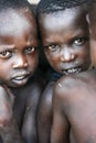 TOPOSA TRIBE, SOUTH SUDAN - MARCH 12, 2020: Kids with dirty skin looking at camera in village of Toposa Tribe in South