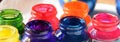 Tops of the bottles of acryl paint Royalty Free Stock Photo