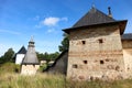 The tops of the fortress wall towers of Pskov-Pechory Dormition Monastery in Pechory, Pskov region, Russia under blue sky Royalty Free Stock Photo