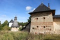 The tops of the fortress wall towers of Pskov-Pechory Dormition Monastery in Pechory, Pskov region, Russia under blue sky Royalty Free Stock Photo